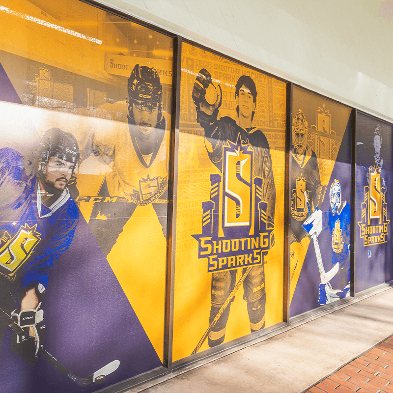 external window display of many hockey players posing in various formats