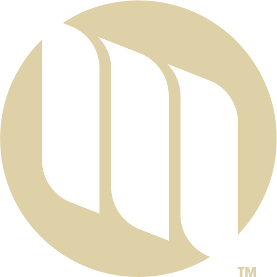 Tan circular logo with three transparent wings forming an 'M,' representing Cormorant Marketing, a Jacksonville FL marketing agency specializing in creative marketing.