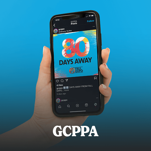 A hand holding an iPhone displaying a visually striking Instagram post, set against a blue background that matches the post, showcasing Cormorant Marketing's success in creating and managing a client's brand identity and social media presence for Jacksonville FL businesses.