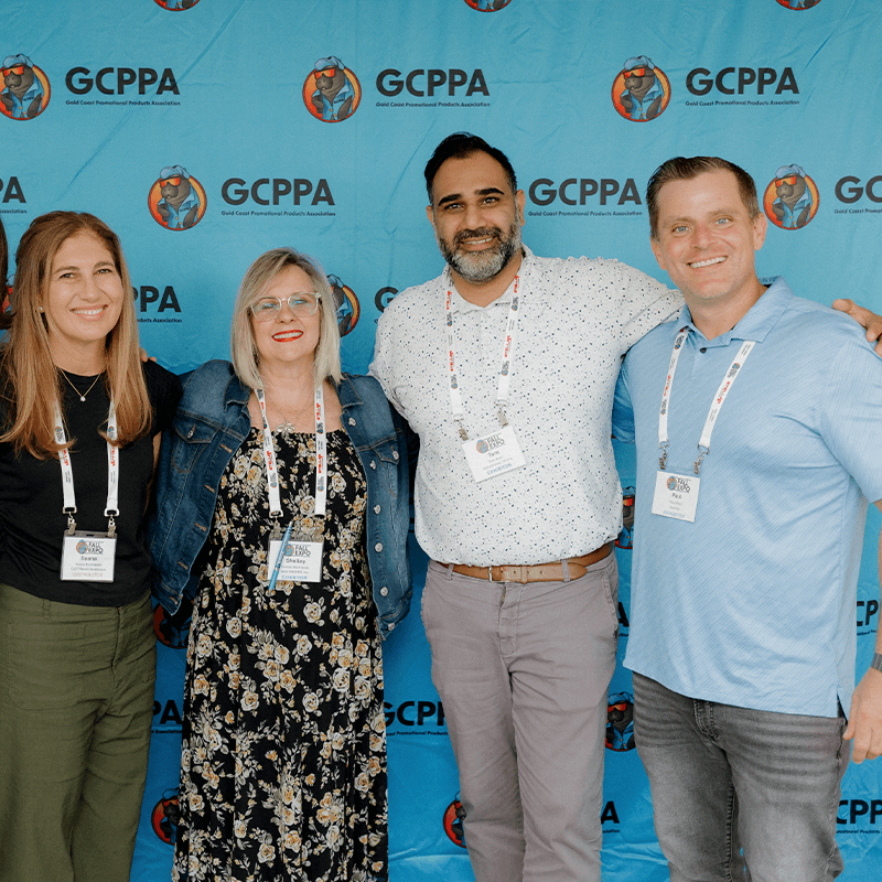 Gcppa Group photo a group of event attendees stand in front of blue backdrop designed by jacksonville marketing agency cormorant marketing