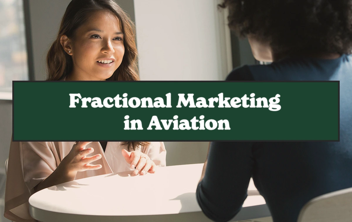 Two professionals discussing fractional marketing strategies in aviation during a business meeting.
